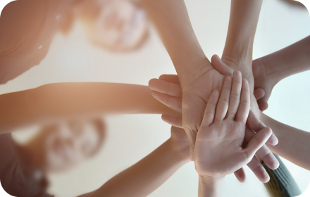 Team hands together representing shared vision